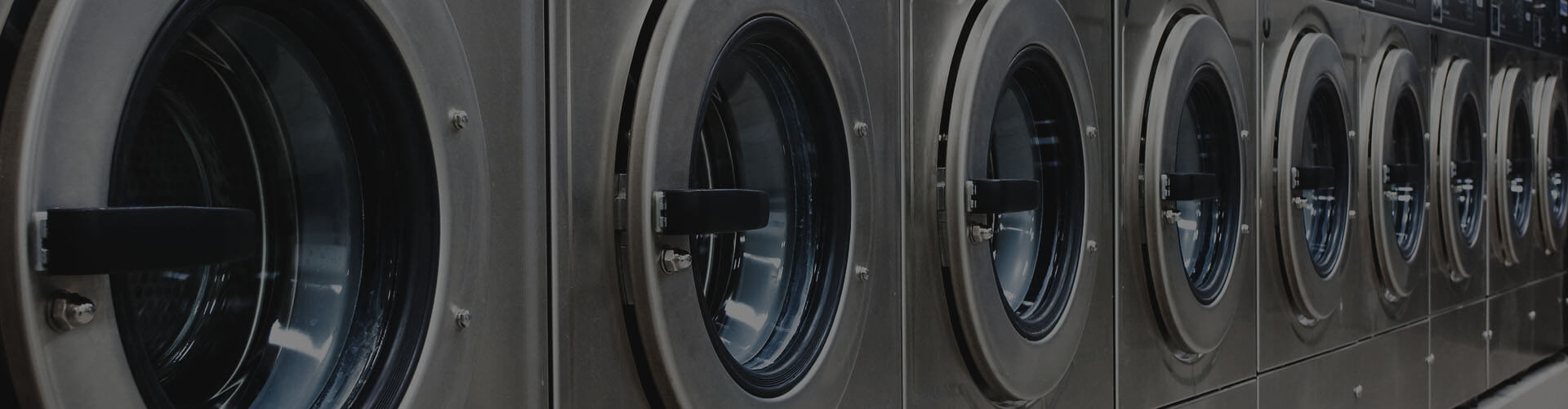 Image of a laundromat with nine washing machines