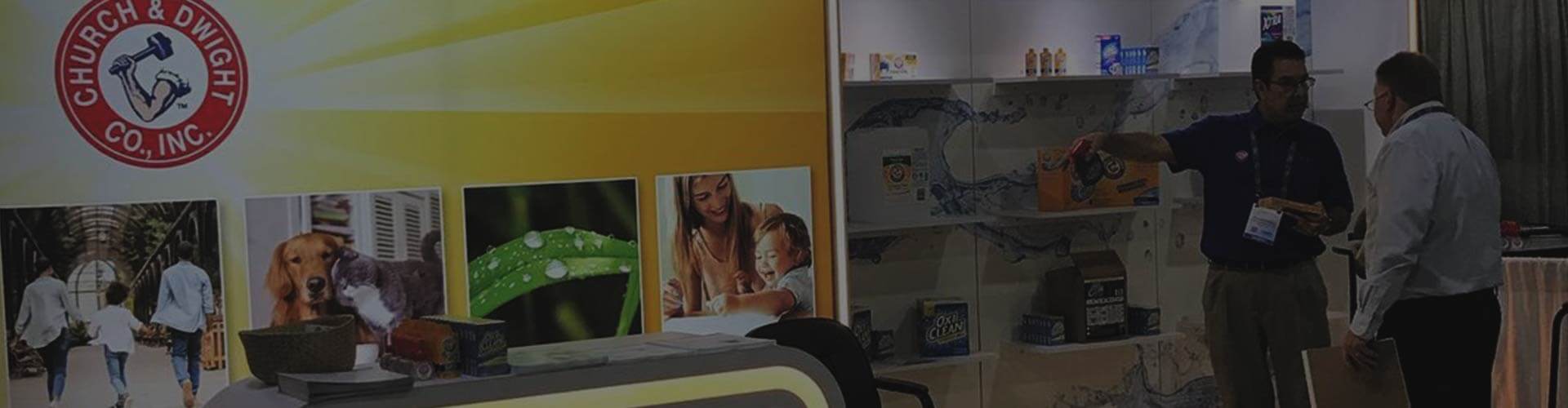 Image with Church & Dwight Co., Inc. logo and two people discussing products.